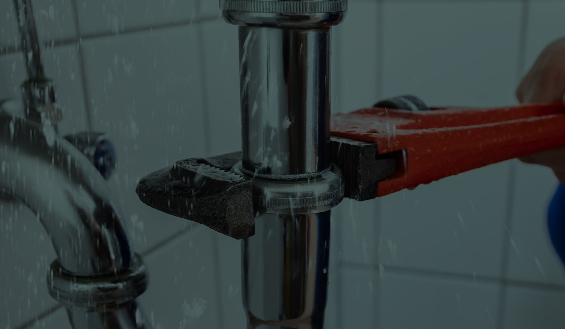 plumber close up with pipes wrench repairing bathroom pipes elk river mn